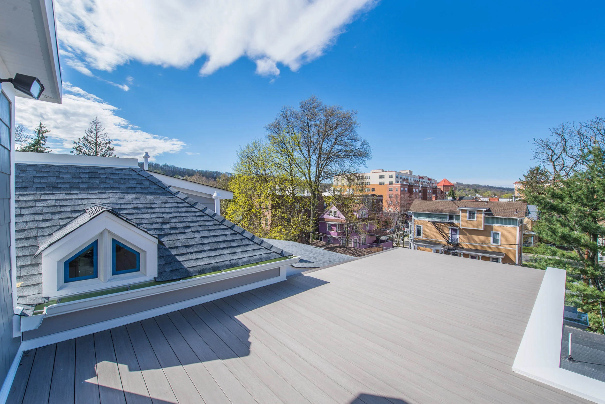 UNIT C _ Private Roof Deck View. Don’t worry we have added a very nice black picket railing !