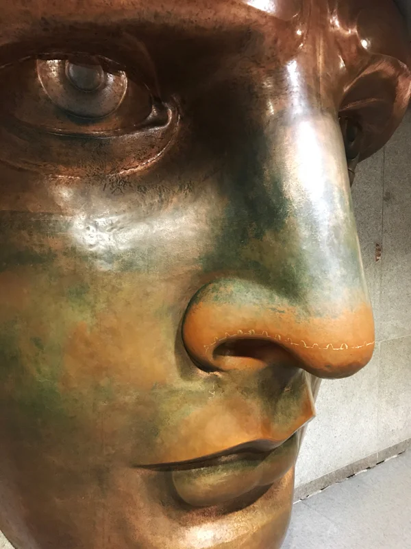 A replica of her face. At more than 8' tall this is copper forming at a most impressive scale.