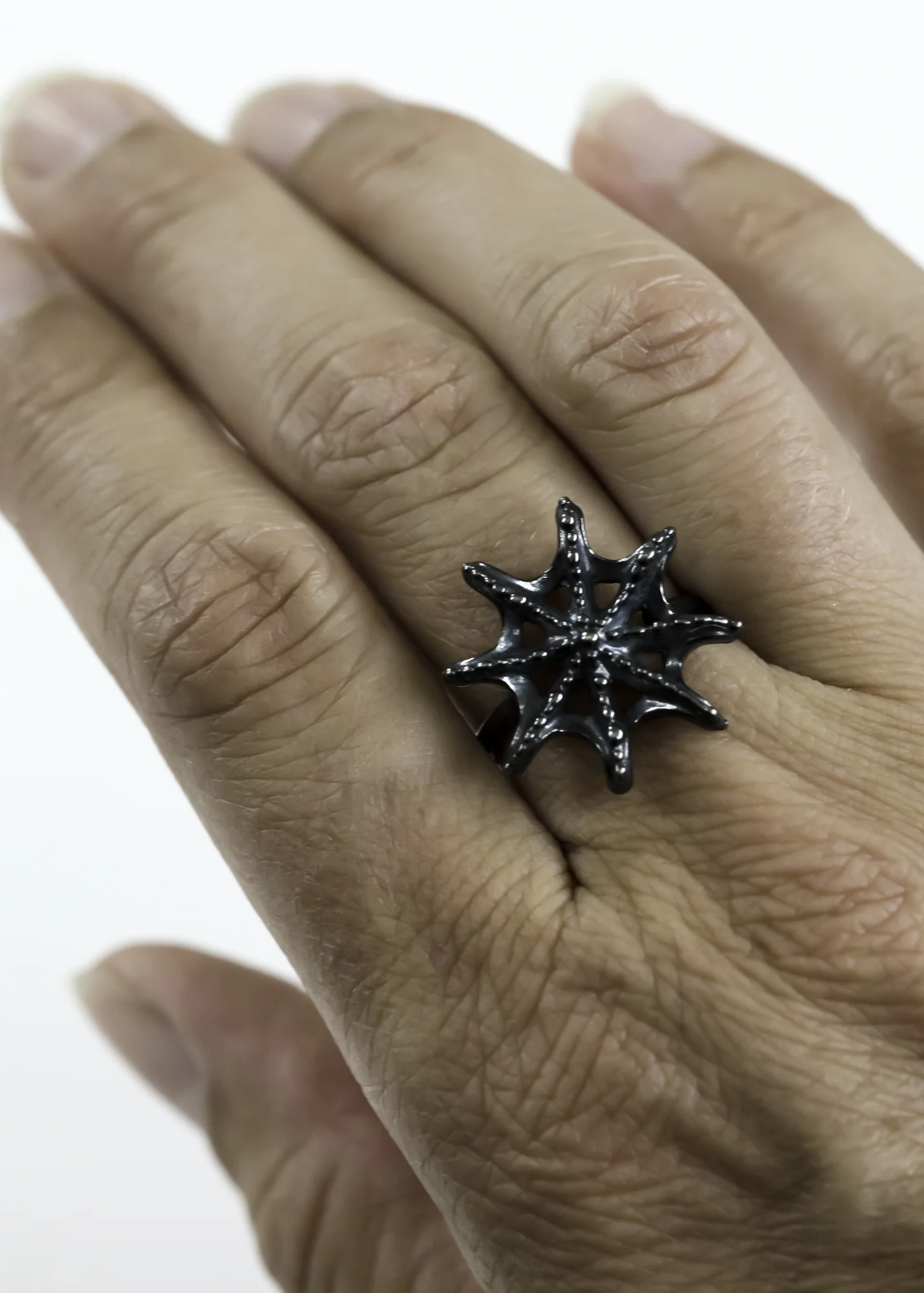 dark silver sea star ring contemporary jewelry design