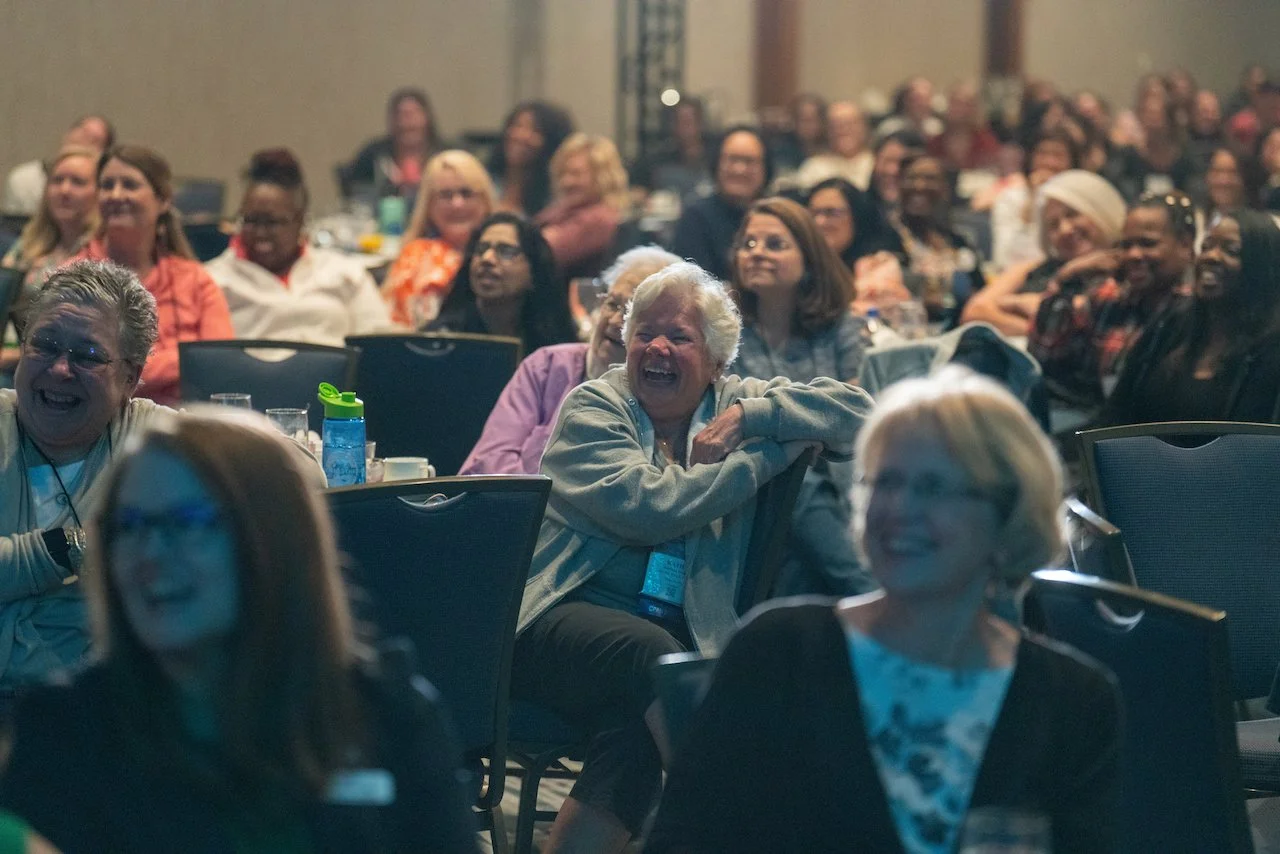 20230501 Healthy Humorist Doctor Brad Nieder Gray Haired Female Audience Member Laughing.jpeg