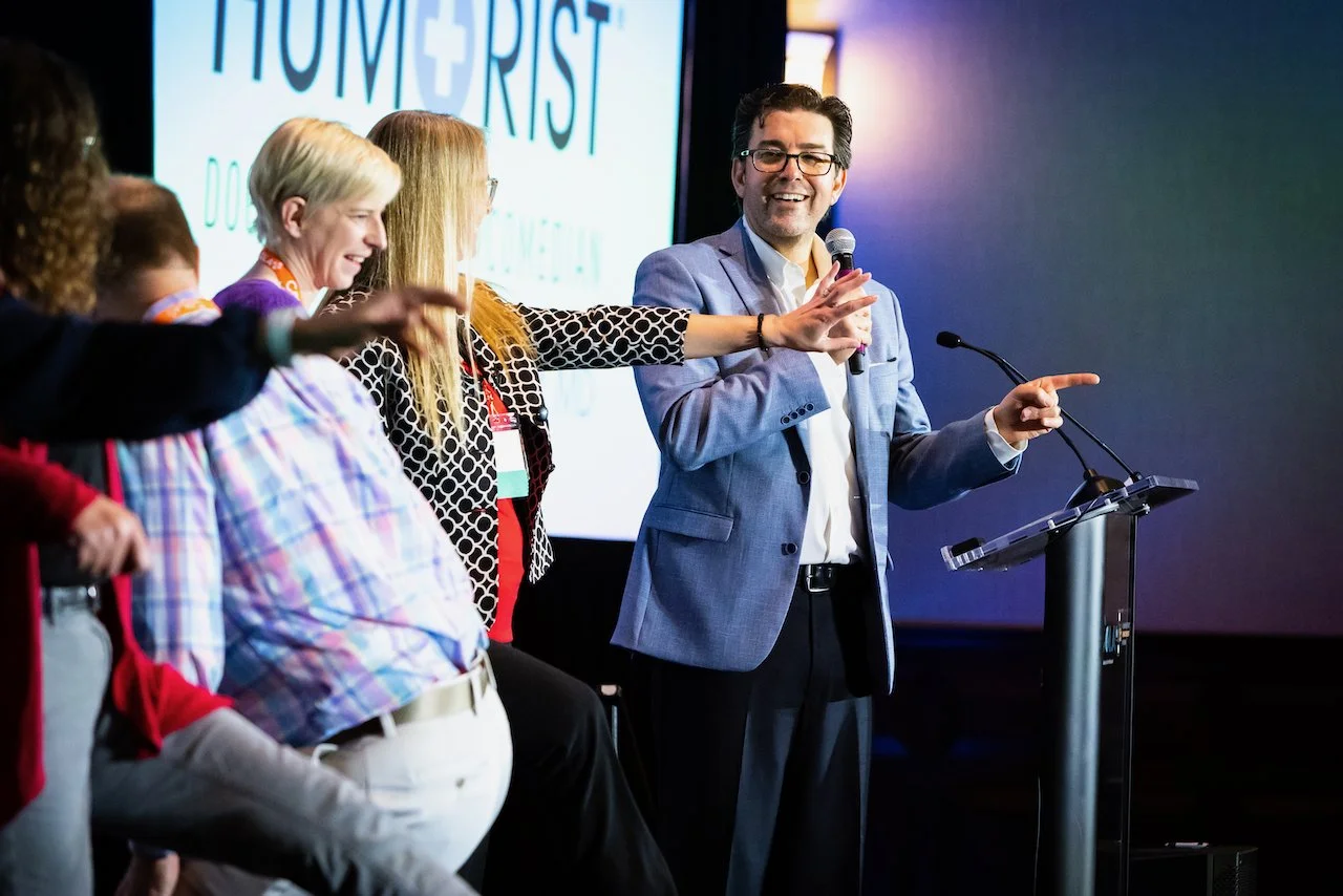20230504 Healthy Humorist Doctor Brad Nieder Side Shot with Participants Dancing On Stage.jpeg
