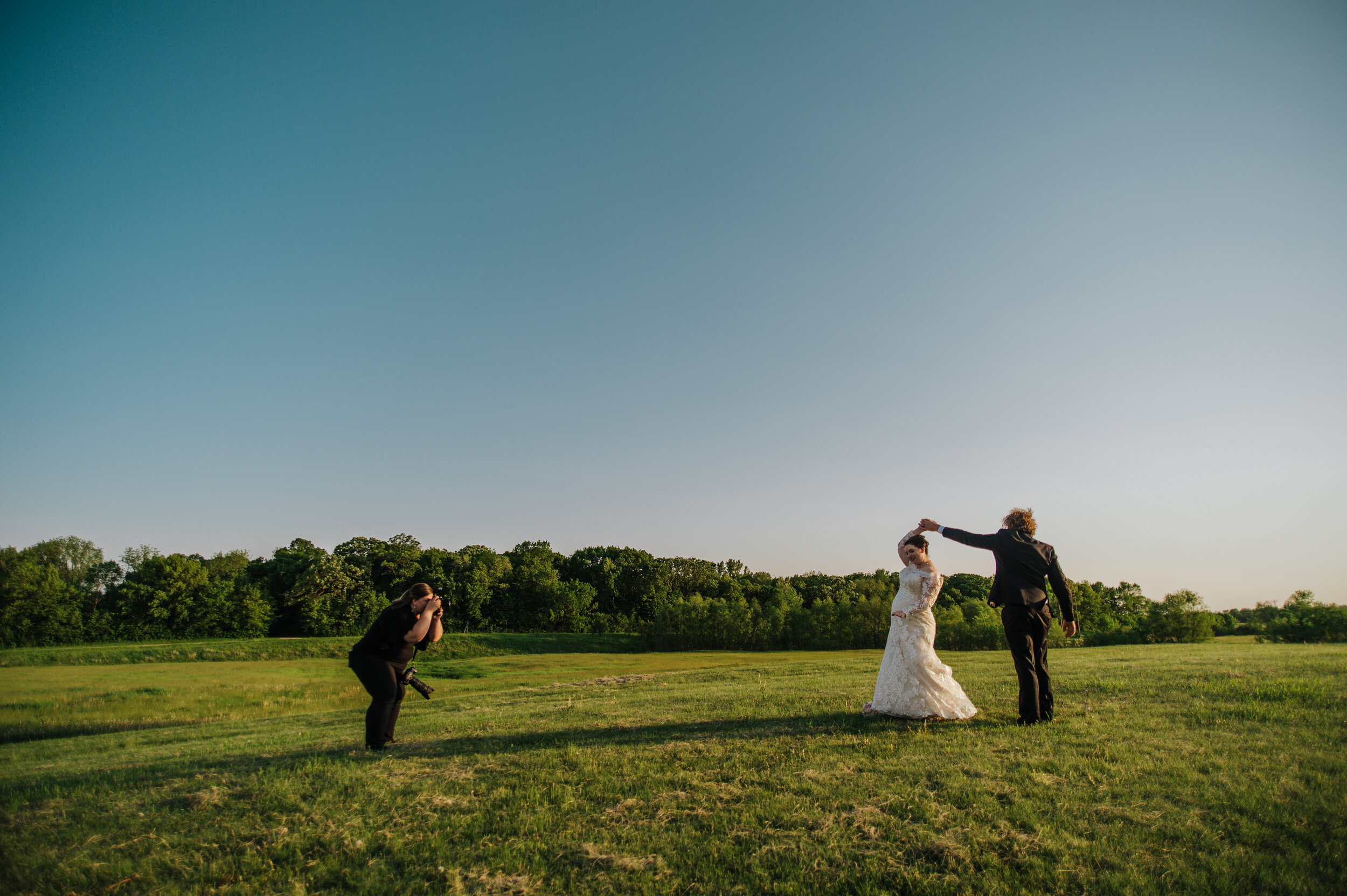 photographer taking photos of bride and groom in Twin Cities