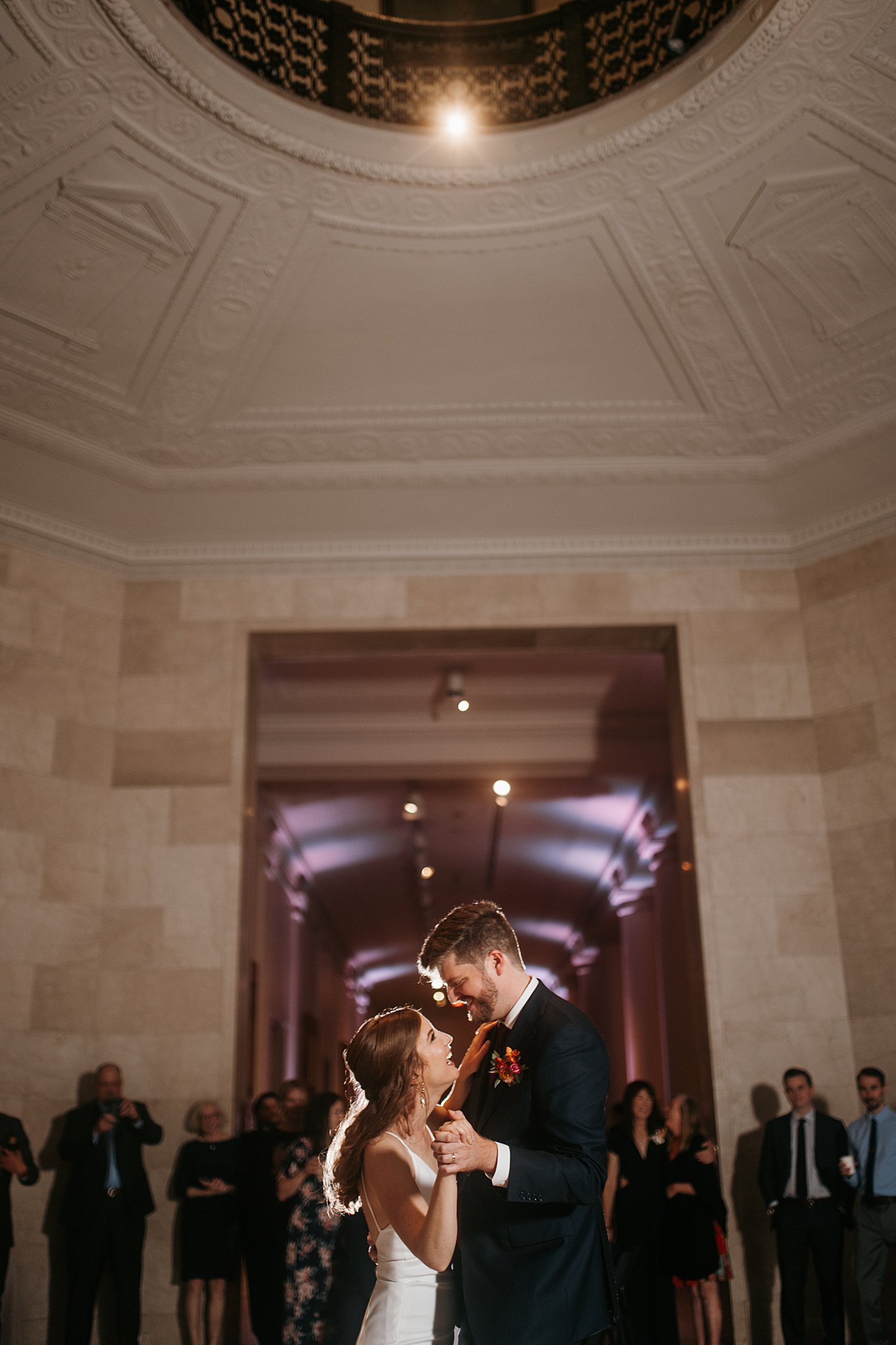Couple shares first dance at wedding at Minneapolis Institute of Art