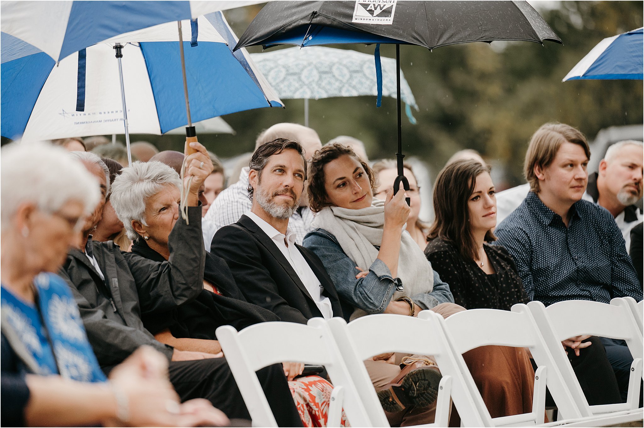 umbrellas at outdoor wedding ceremony in the rain