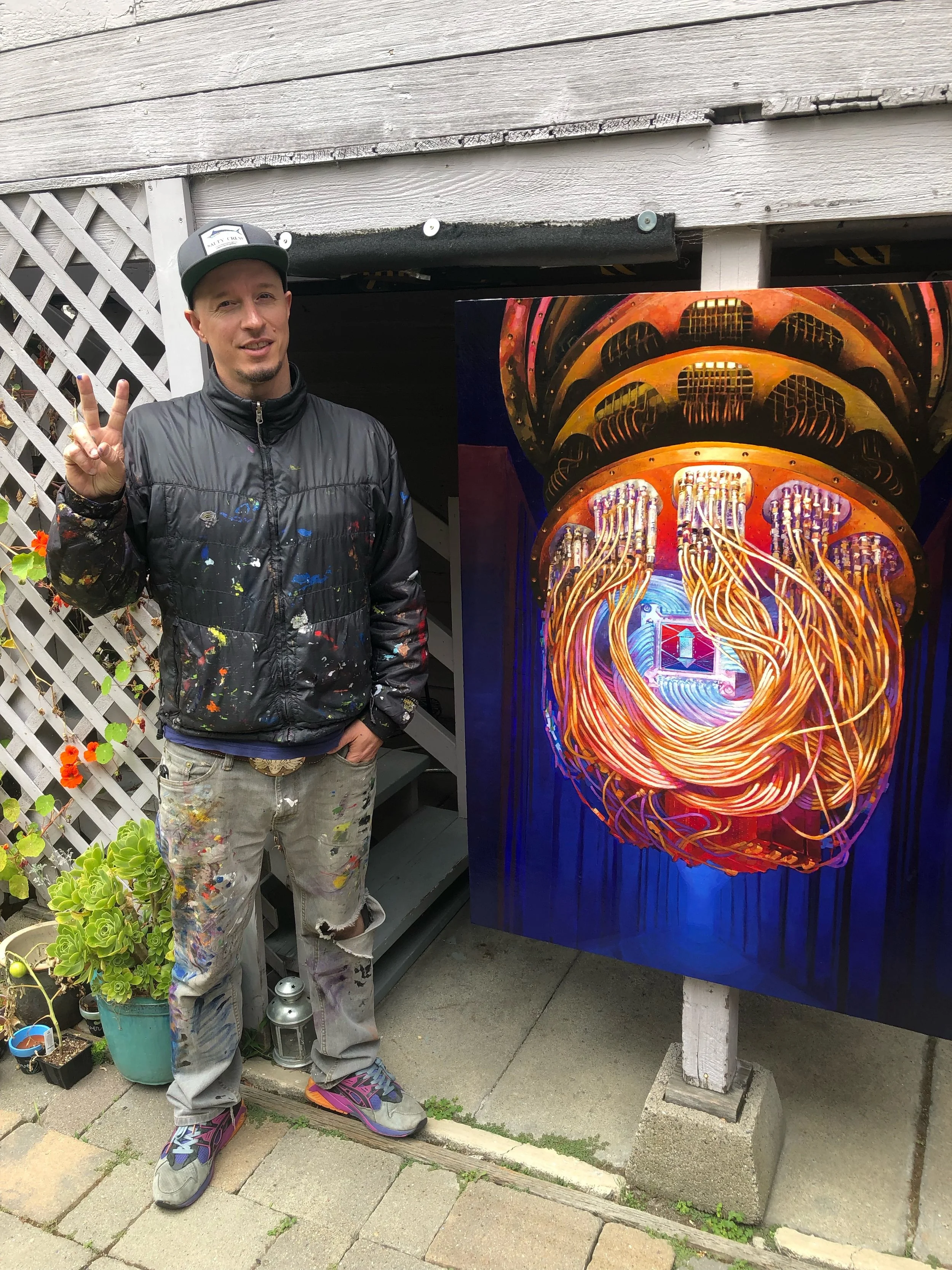 Stearns in front of his illustration of a quantum computer. Photo: Stearns collection