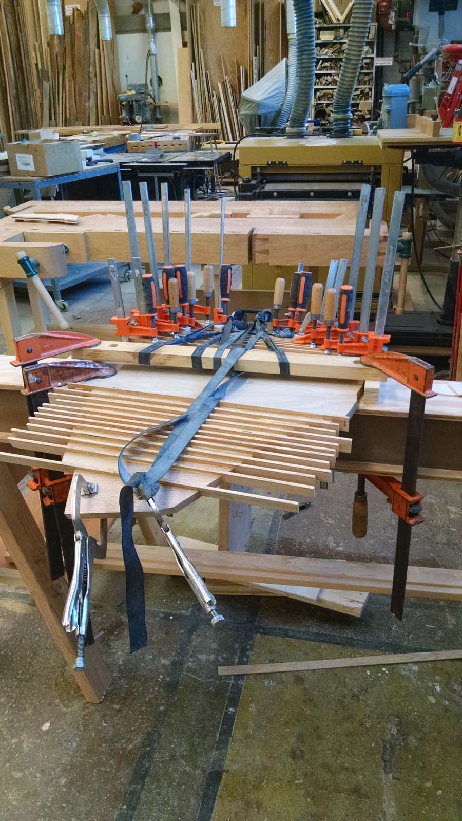 SEAT DRYING - wedges glued into kerfs, causing curvature, then clamped into place