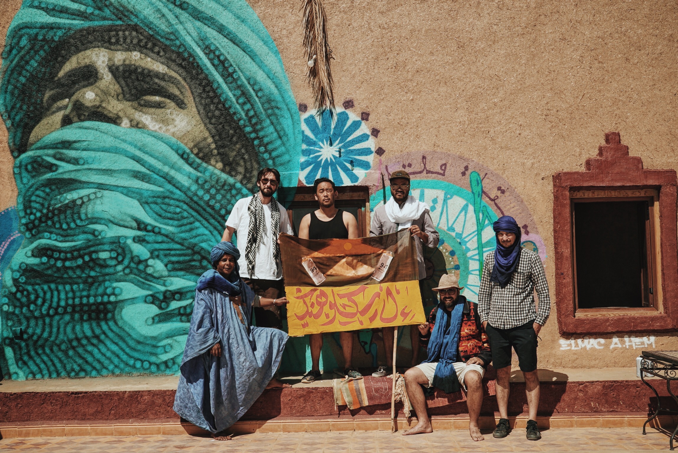 El Mac , David Choe , Andrew Hem , Mars-1 , and Esao Andrews with Hssain Ahnana, respected leader in Merzouga and subject of El Mac's portrait for the Igloo Hong project