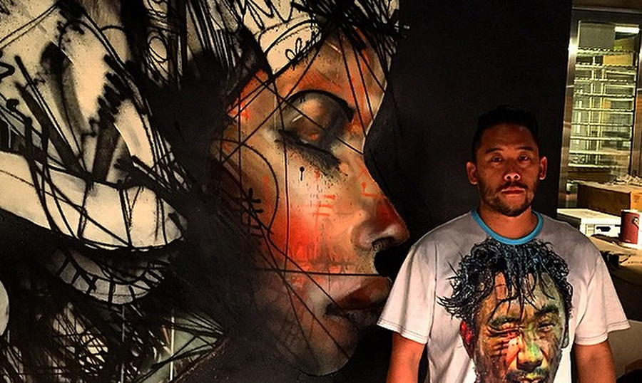 David Choe by his mural at Momfuku Ko, New York