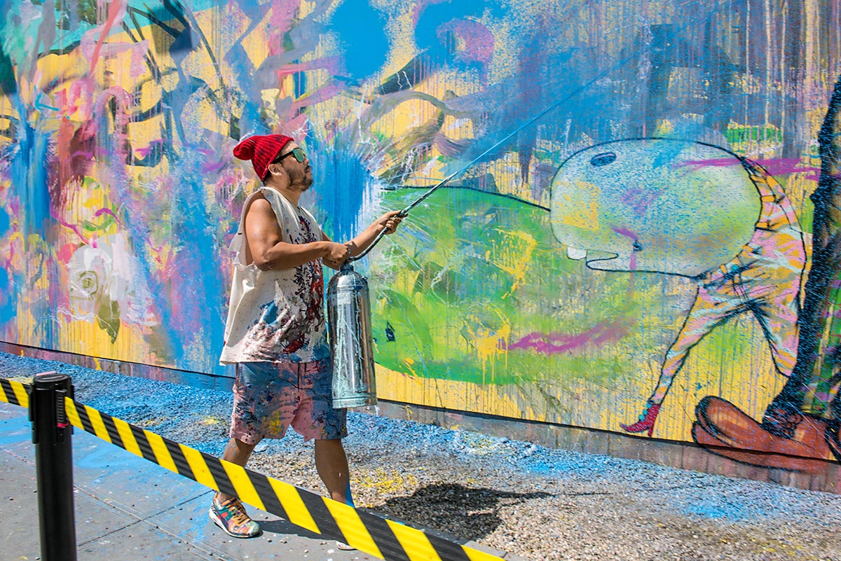 David Choe paints with a fire extinguisher for a new mural at the Bowery in...