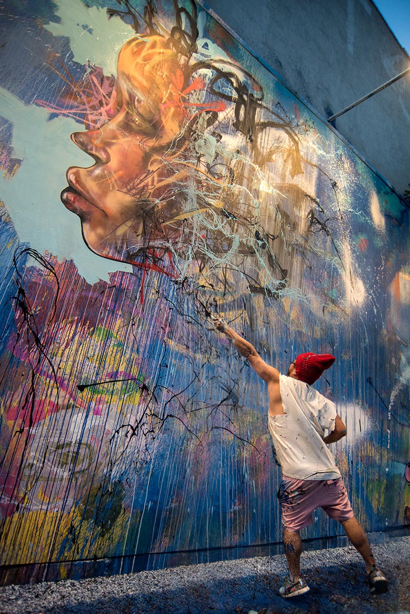  David Choe painting a mural at the Bowery Wall New York. Photo by Martha Cooper. 