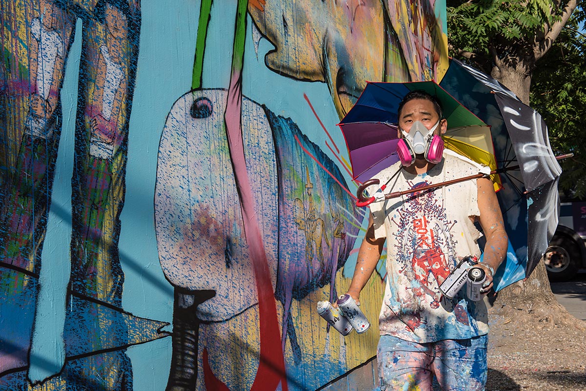 Artist David Choe painting a mural at the Bowery graffiti wall in New York....