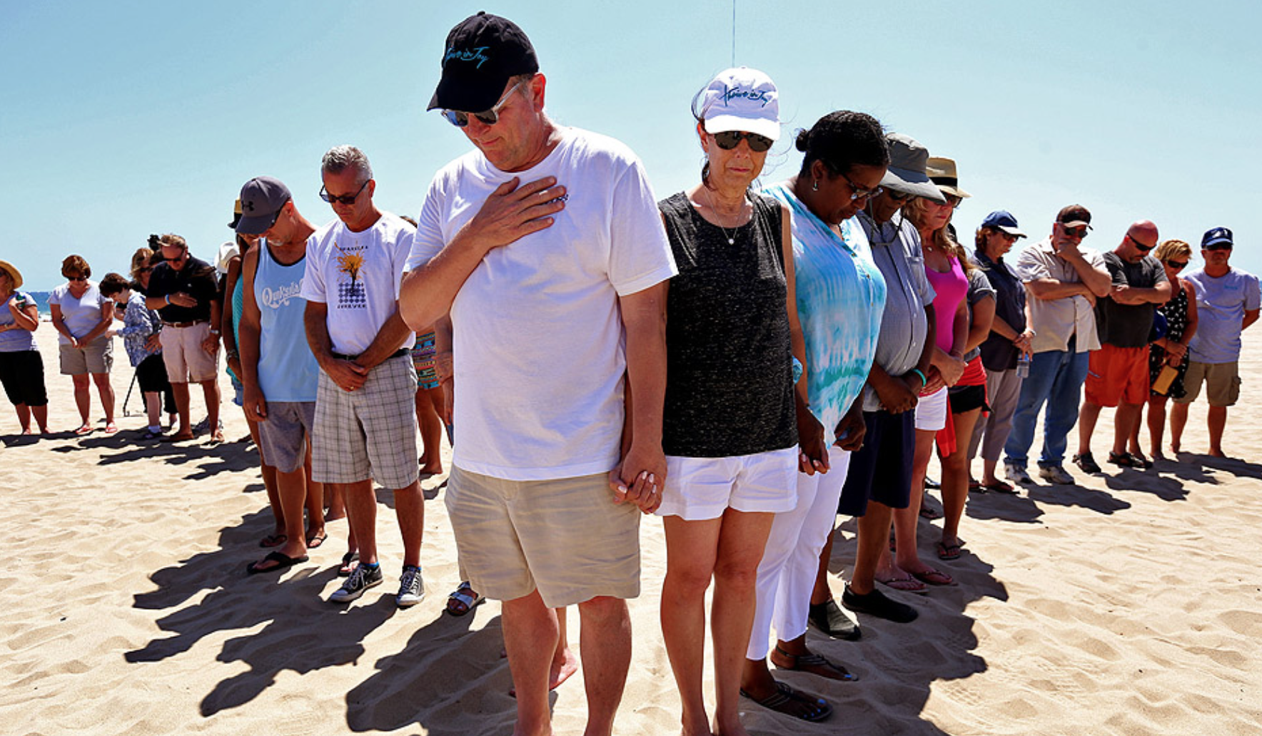 Jay Fagnano, center left, and his wife, Mary, center right, join family and friends in remembrance of their son Nick Fagnano on the one-year anniversary of his death caused by lightning in Venice. MORE