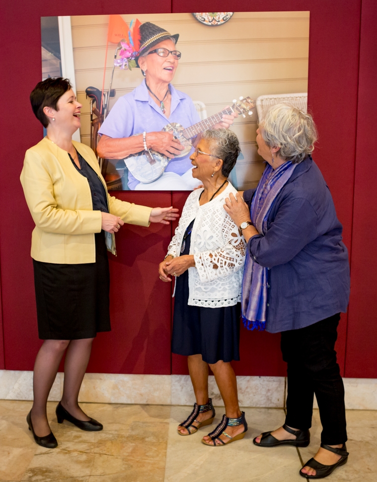 Rita Lucas (centre), a subject from 'The Art of Ageing', sees her photograph in story at Parliament House. She is joined by Minister for Ageing Tanya Davis (left) and photographer Julie Slavin (right).