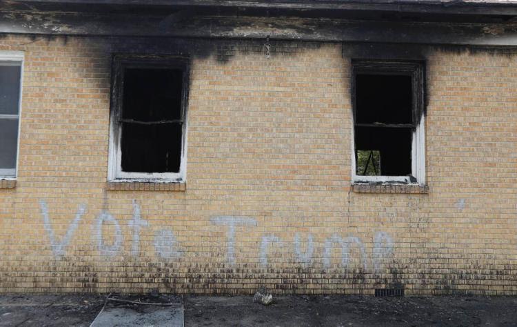 “Vote Trump” is painted on the side of the fire-damaged Hopewell Missionary Baptist Church in Greenville, Miss. (Rogelio V. Solis/AP)