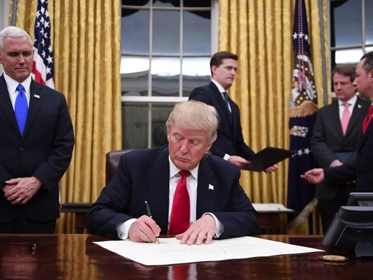 Just minutes after taking the Oath of Office, President Trump took action to begin work repealing Obamacare. Vice President looks on as the Executive Orders are being signed.