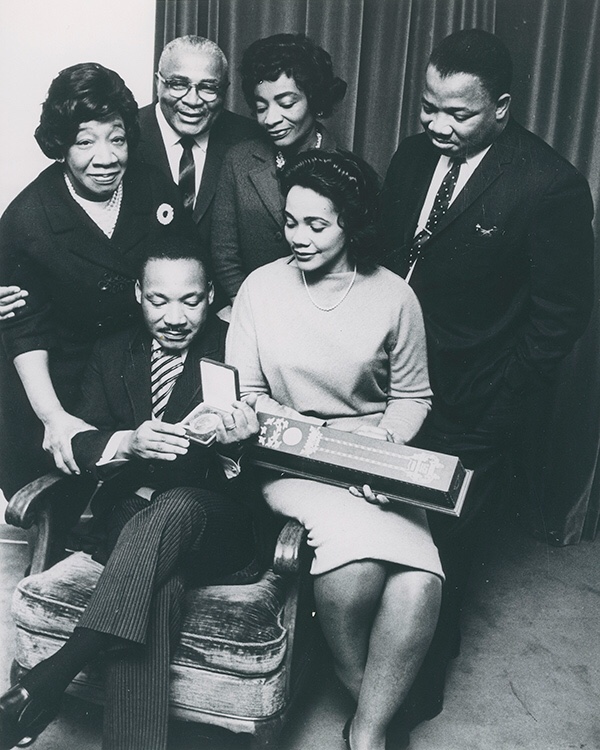Moneta Sleet Jr., Martin Luther King Jr., surrounded by his family, holding the Nobel Peace Prize medal (1964). Photo courtesy Johnson Publishing Company