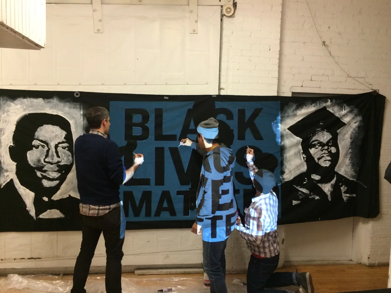 MAKESH!T members creating the BLM banner.
