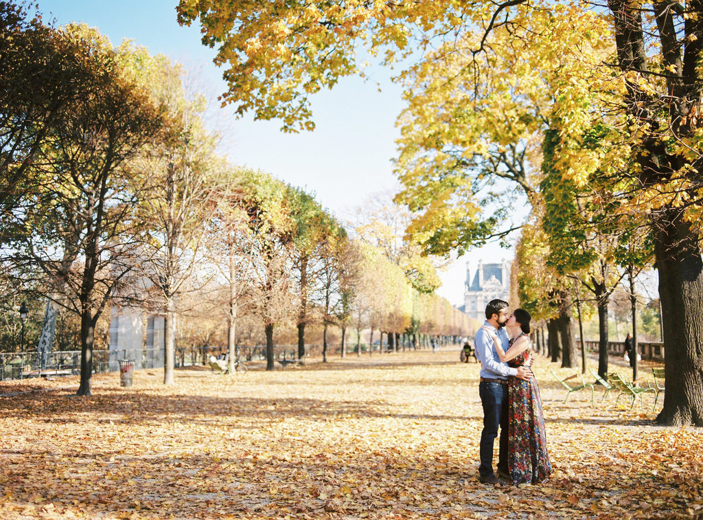 Couple under a tree in Parisian Autumn in Jardin des Tuileries