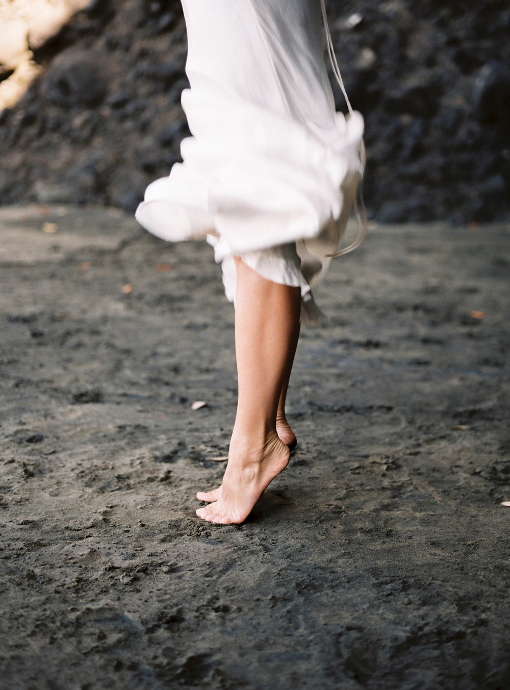 Barefoot bride on the beach dress movement