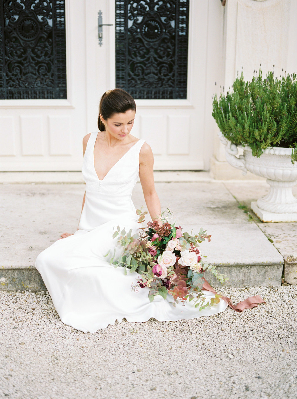 Bride with wedding bouquet wearing Charlie Brear dress