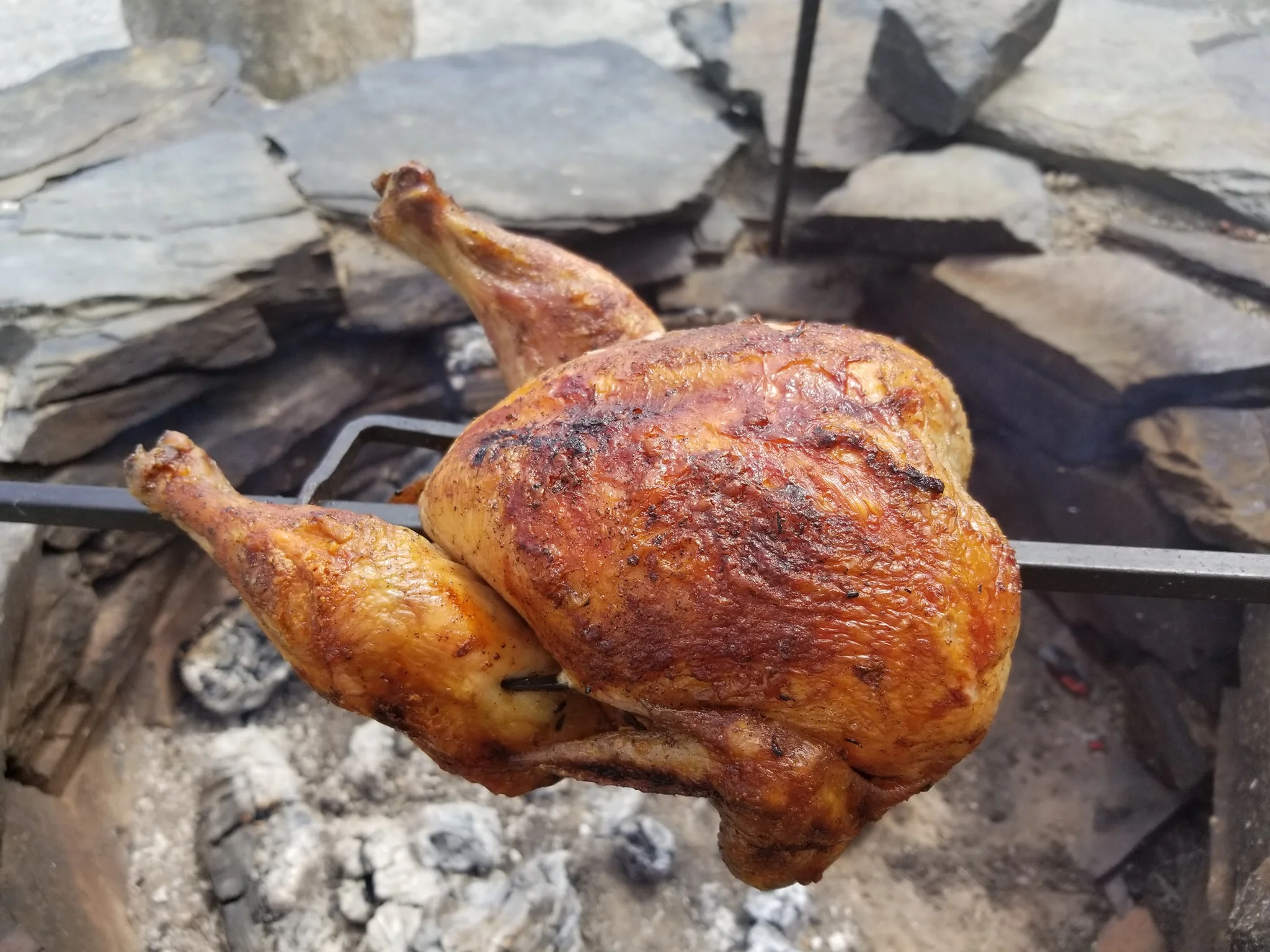 L & K’s spit roasted chicken over an open fire. YUMMMMMMMMM!