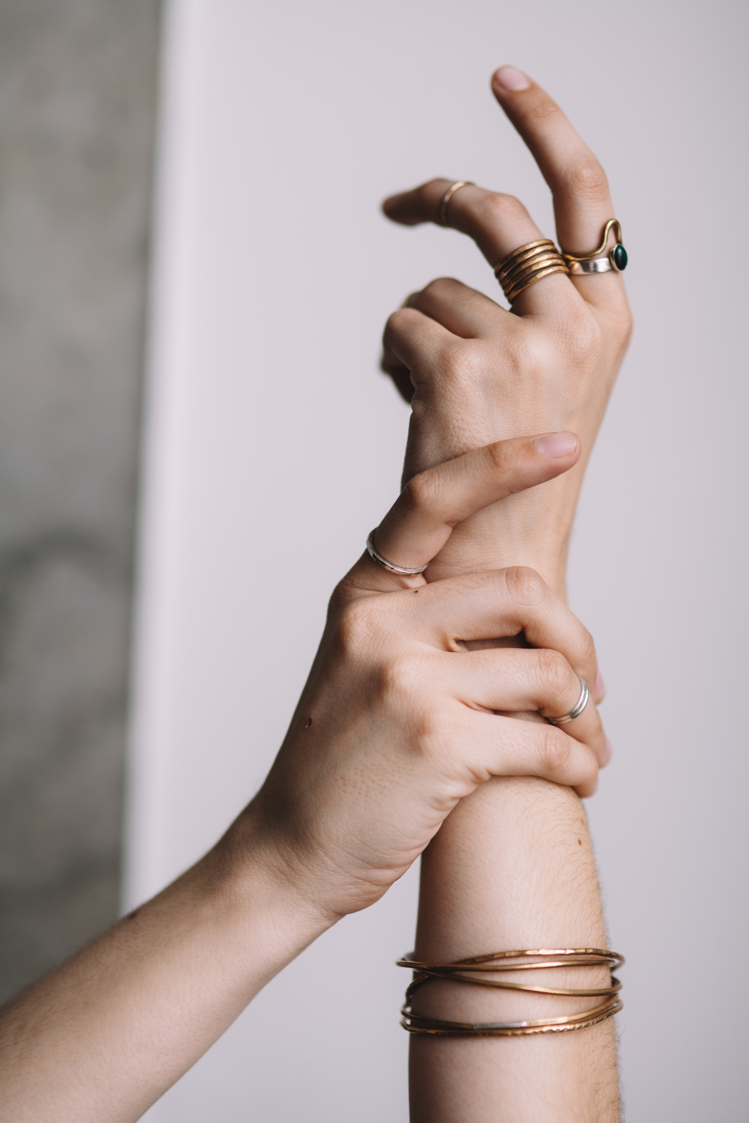 silver and bronze stacking rings, bronze entwine bangle 