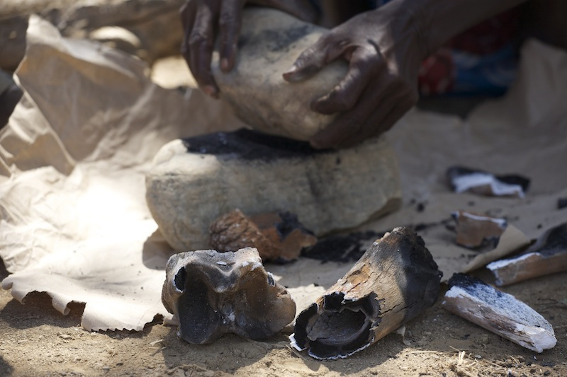 14-grinding burned bones to powder.jpeg