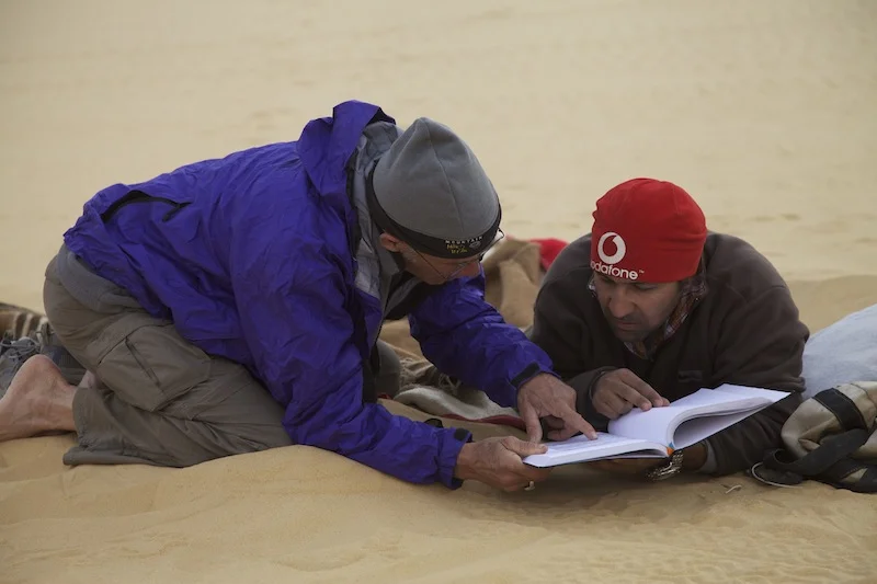 Consulting Sykes' journal to plan the next route