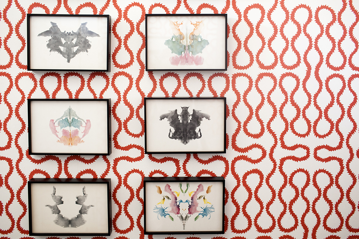A wall of art in Lisa's home.
