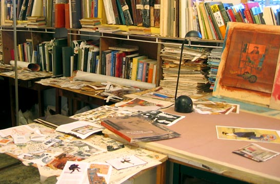 Patrick L. incorporates collage from vintage sources in his work, which is evident in his eclectic studio. 