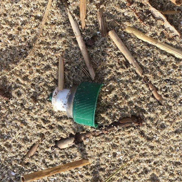 Hey, @polandspringwtr! Is this your crap on my beach? I was enjoying my day at the beach until I saw this piece of crap! Tell your customers to #reducereuserecycle or start making your products #biodegradable. #pollution #beachcrap #beachgarbage #get