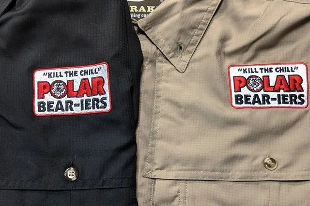 Custom commercial logo embroidery stitched onto a corporate workwear jacket.
