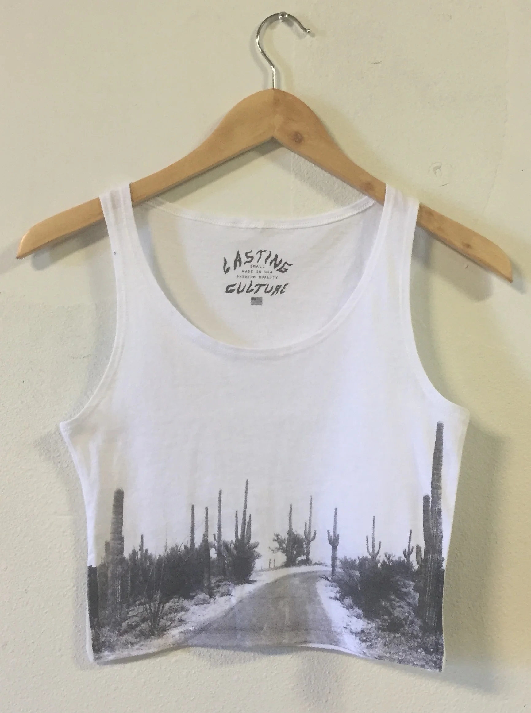 Private label apparel manufacturing and soft-hand screen printing on white tank tops for Lasting Culture.