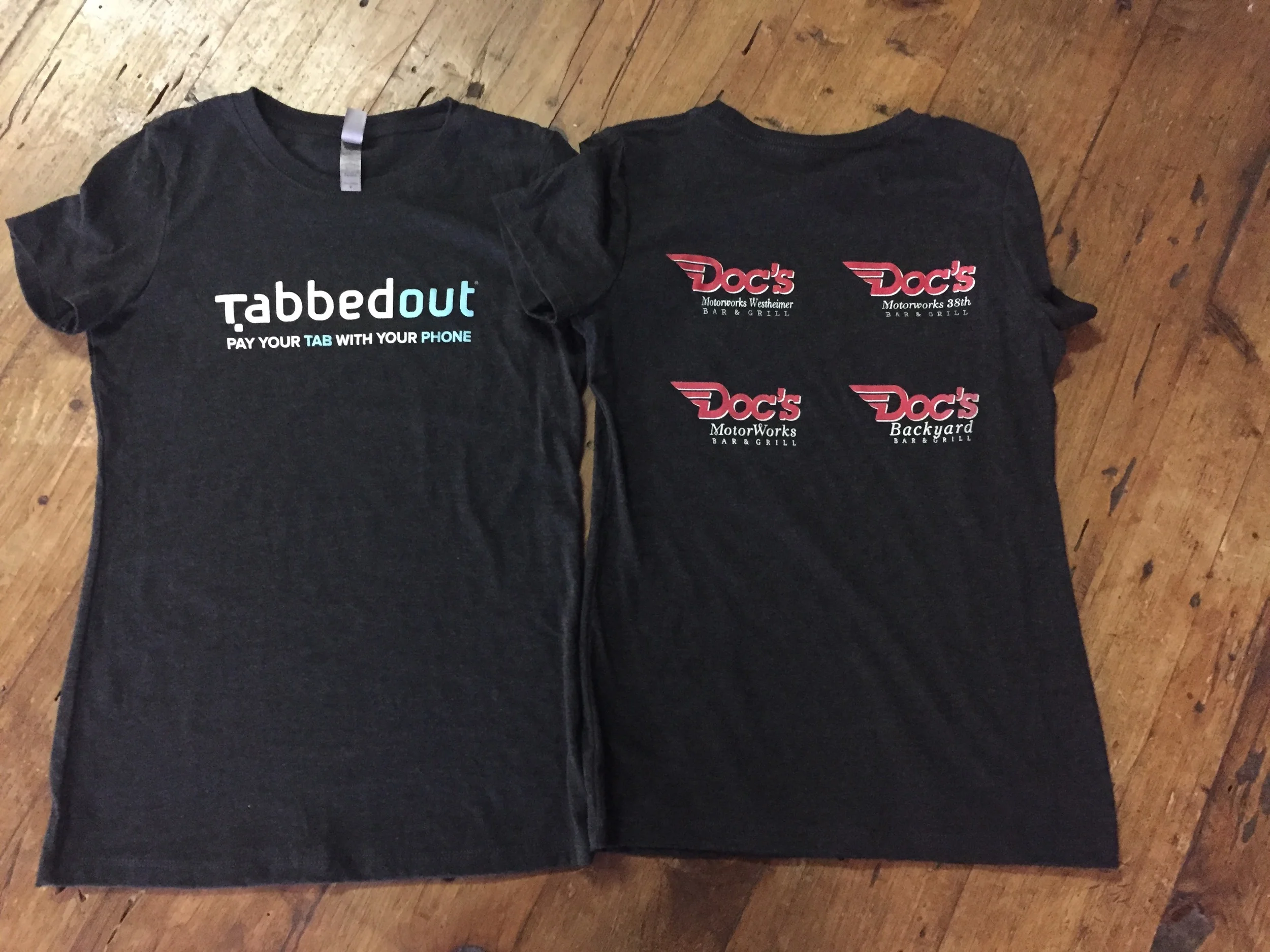 Bulk custom screen printed promotional apparel produced for Tabbedout and Doc's Backyard in Austin, TX.