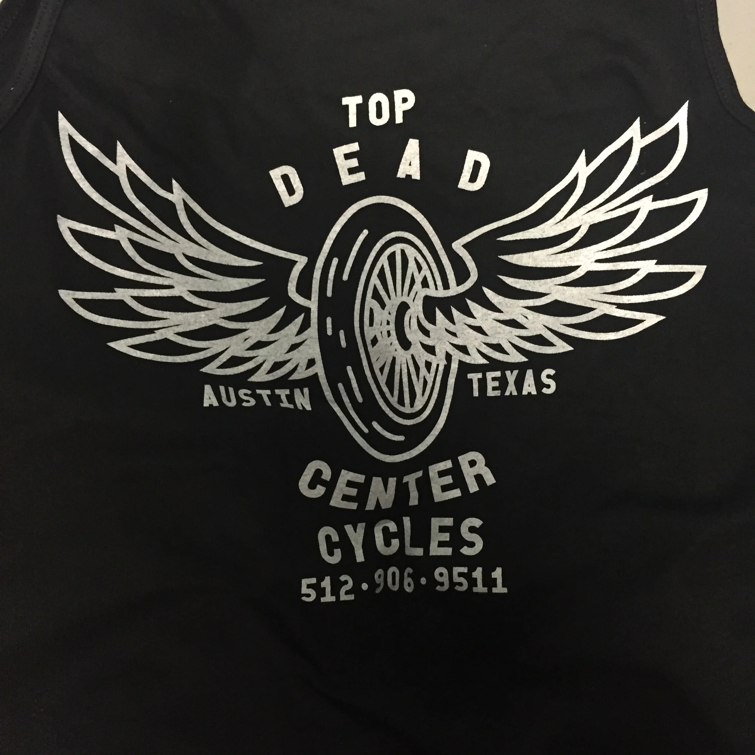 Custom screen printed retail merchandise apparel produced for Top Dead Center Cycles in Austin, TX.