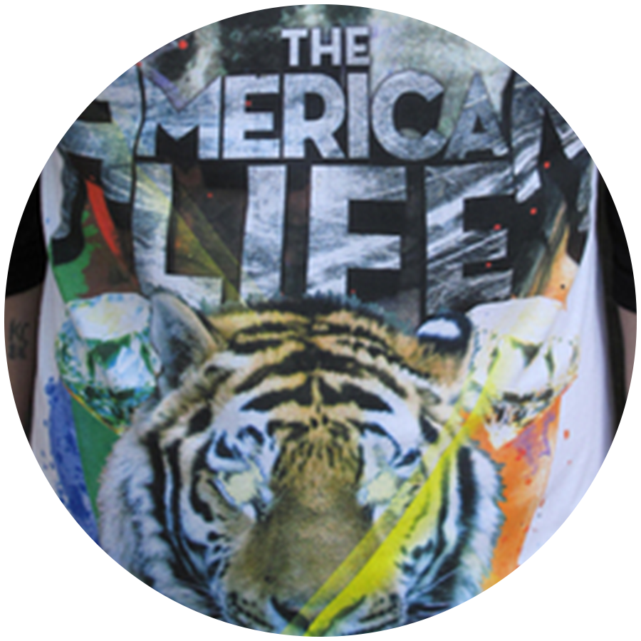 Highly detailed full-color CMYK process screen printing featuring a tiger graphic on a t-shirt.