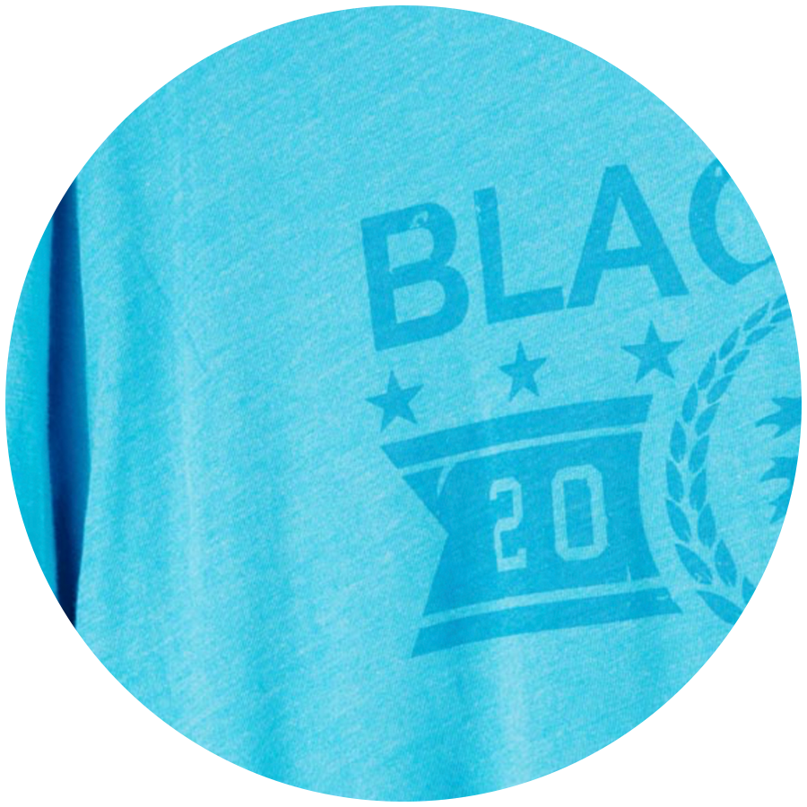 Zero-feel water-based discharge screen printing applied to a blue cotton garment.