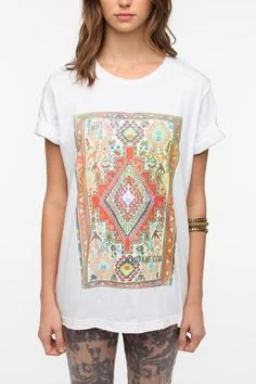 Water-based custom screen printing on white boutique fashion tees featuring a colorful geometric graphic.