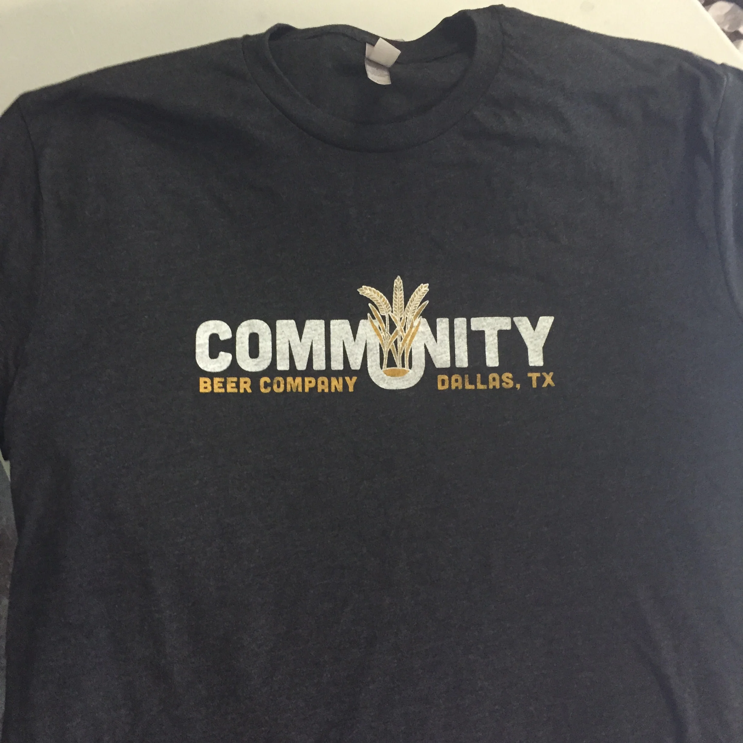 Custom screen printed brewery merchandise t-shirts manufactured for Community Beer Company in Dallas, TX.