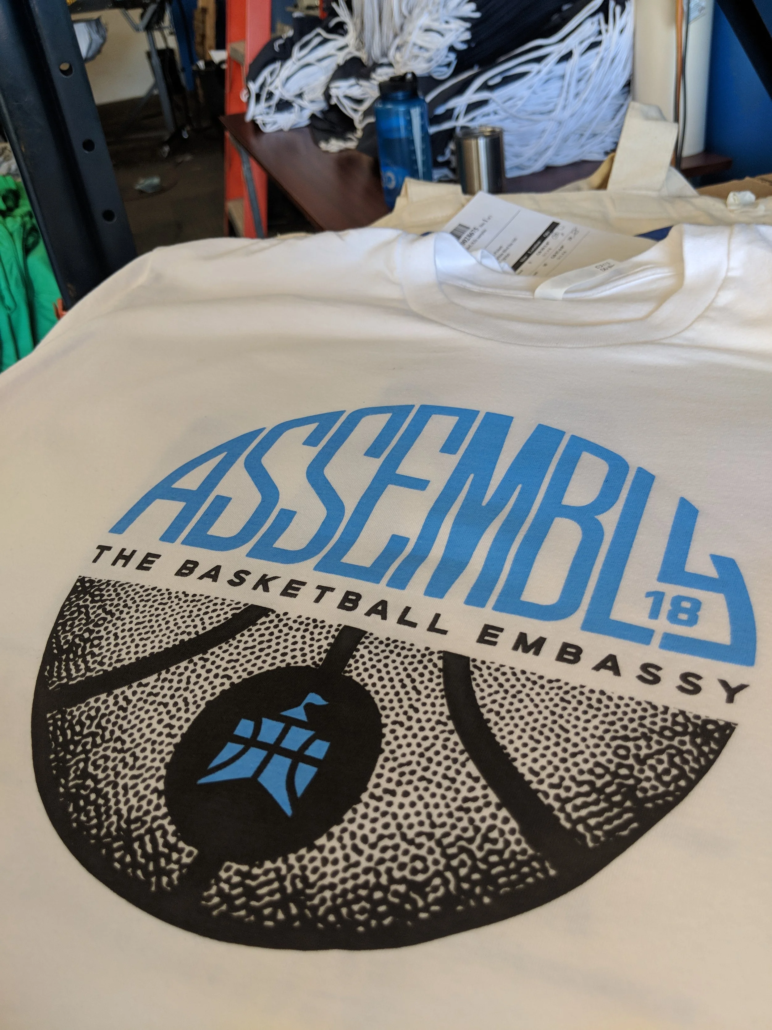 Custom screen printed event apparel produced for Assemble 18 by The Basketball Embassy in Austin.