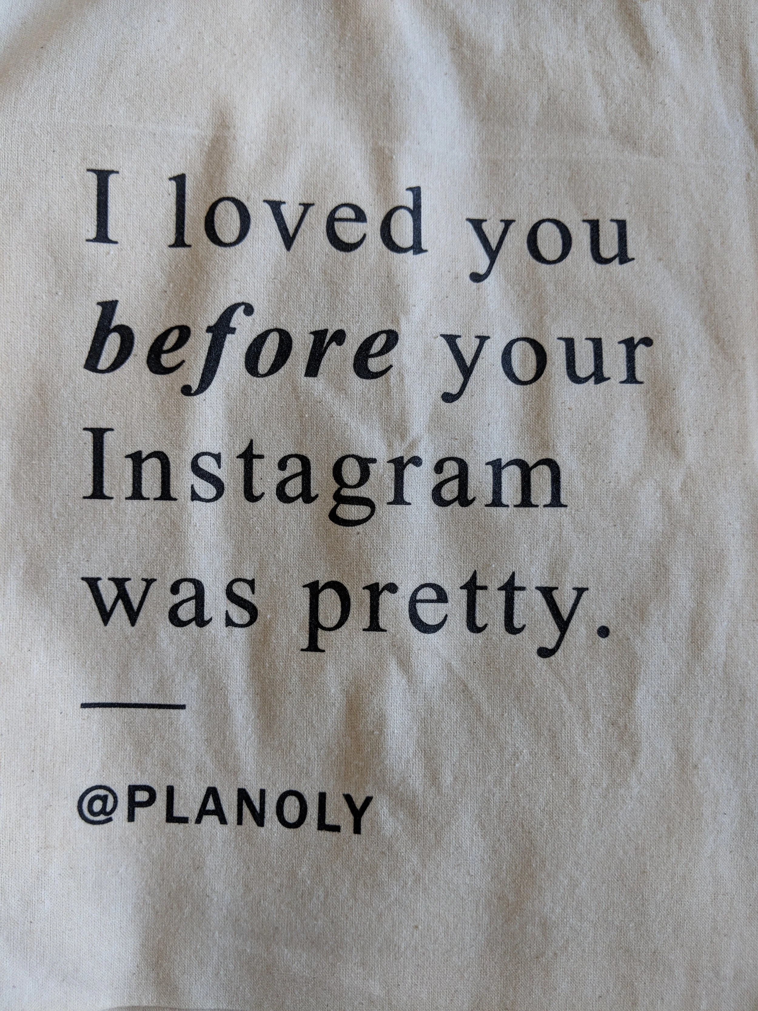 Soft-hand custom screen printing on startup merchandise t-shirts produced for Planoly.