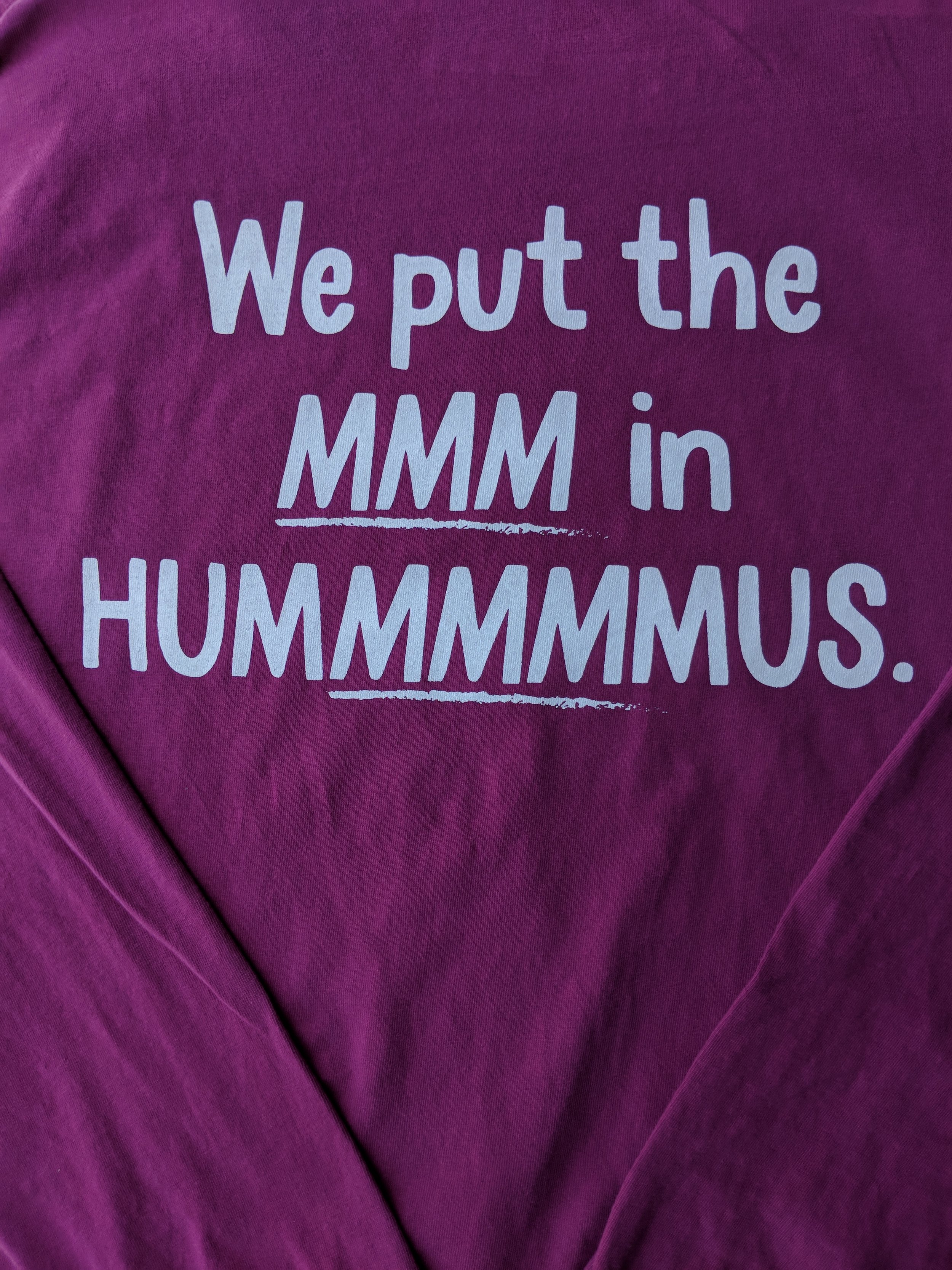 Soft-hand custom screen printed promotional apparel reading We put the MMM in Hummus produced for Lantana.