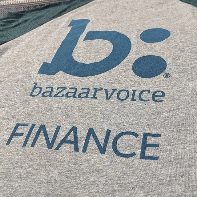 Custom screen printed company uniform shirts produced for the Bazaarvoice Finance department in Texas.