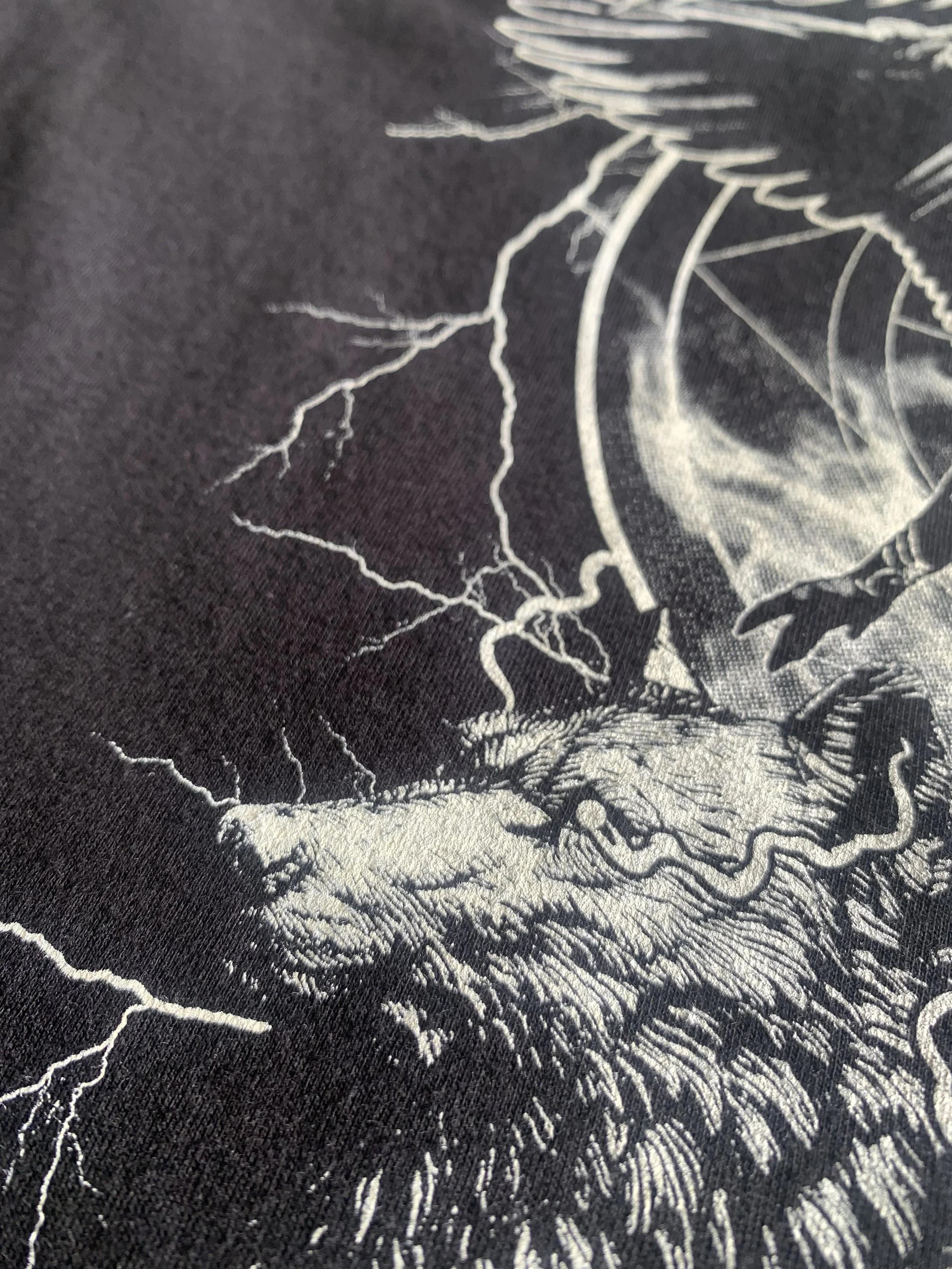 Close-up detail of soft-hand vintage custom screen print on cotton tee