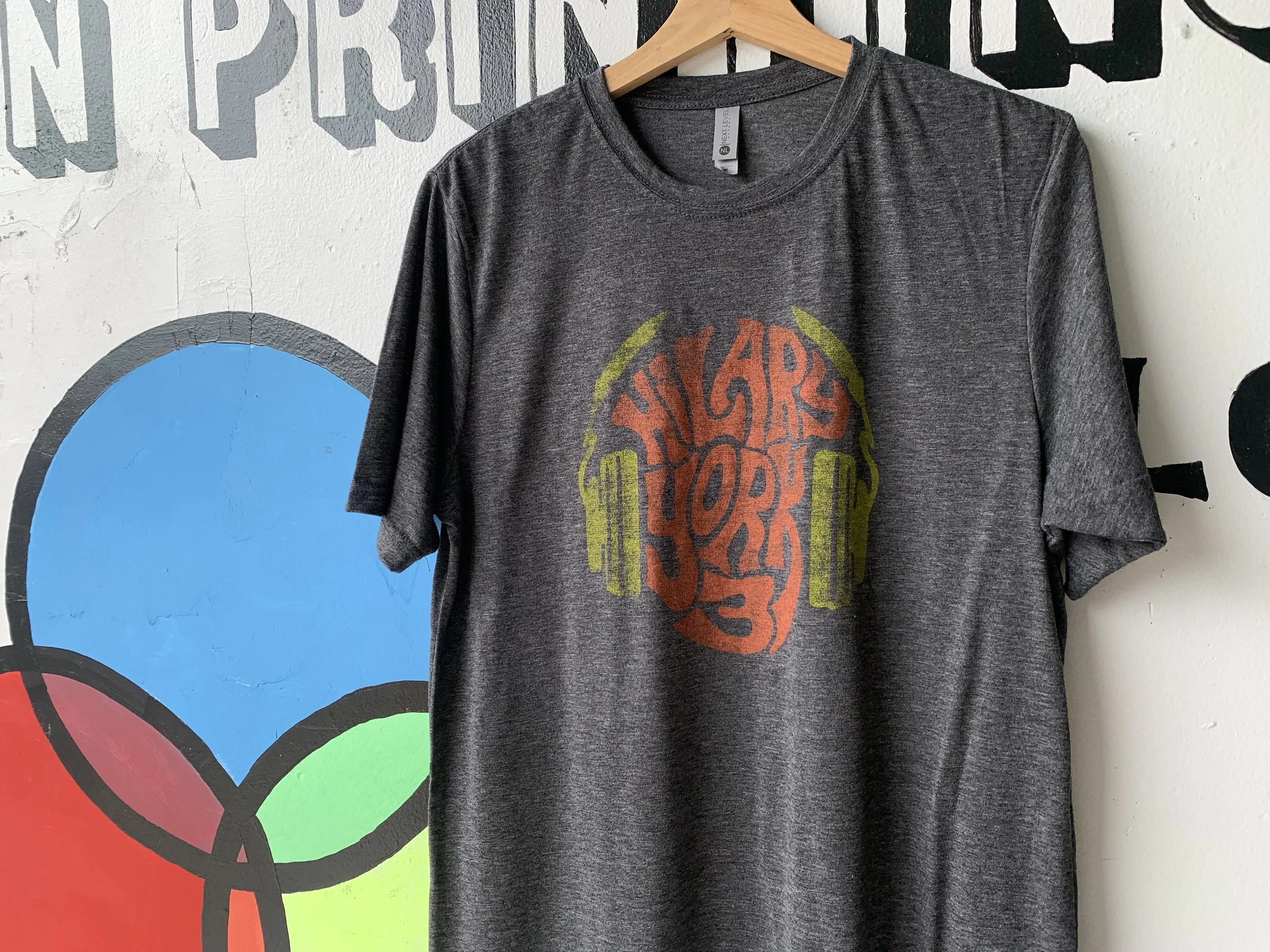 Zero-feel water-based discharge screen print on dark cotton garment