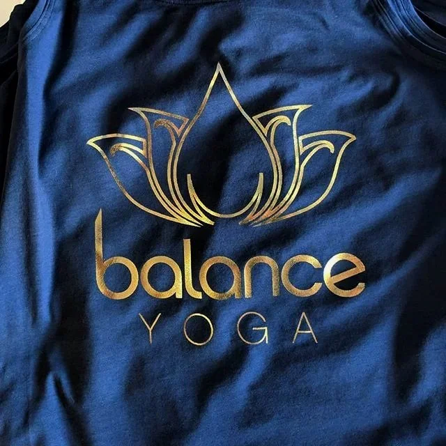 Custom screen printed yoga apparel featuring flexible low-cure poly inks produced for Balance Yoga.