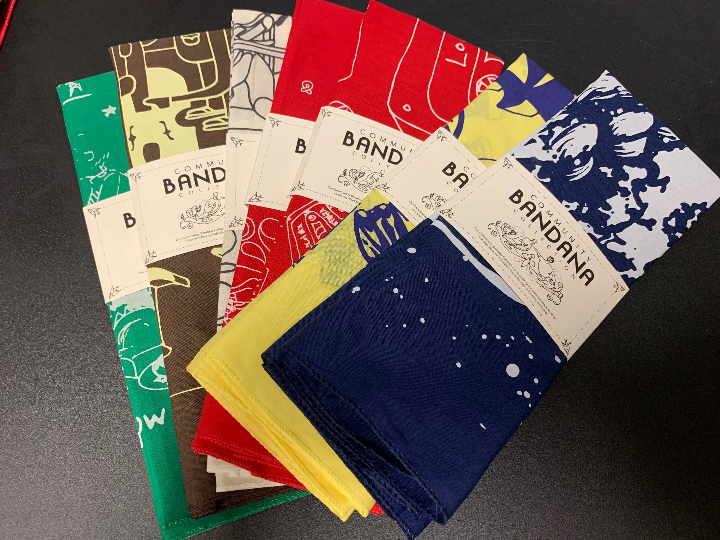Bulk custom screen printed bandanas produced as promotional swag for Austin events.