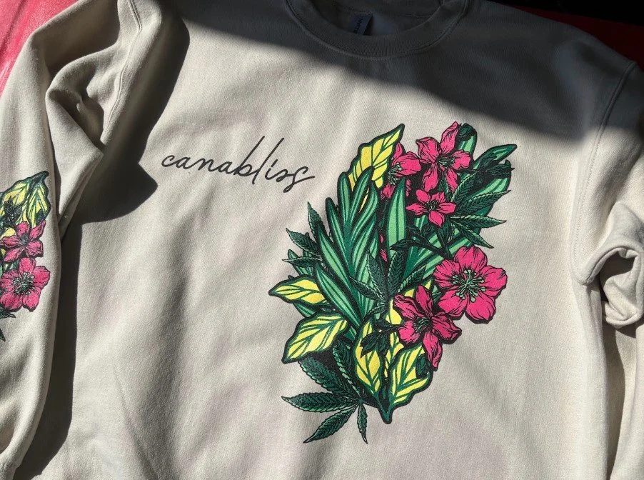 Retail-quality custom screen printing featuring botanical graphics produced for the Cannabliss clothing brand.