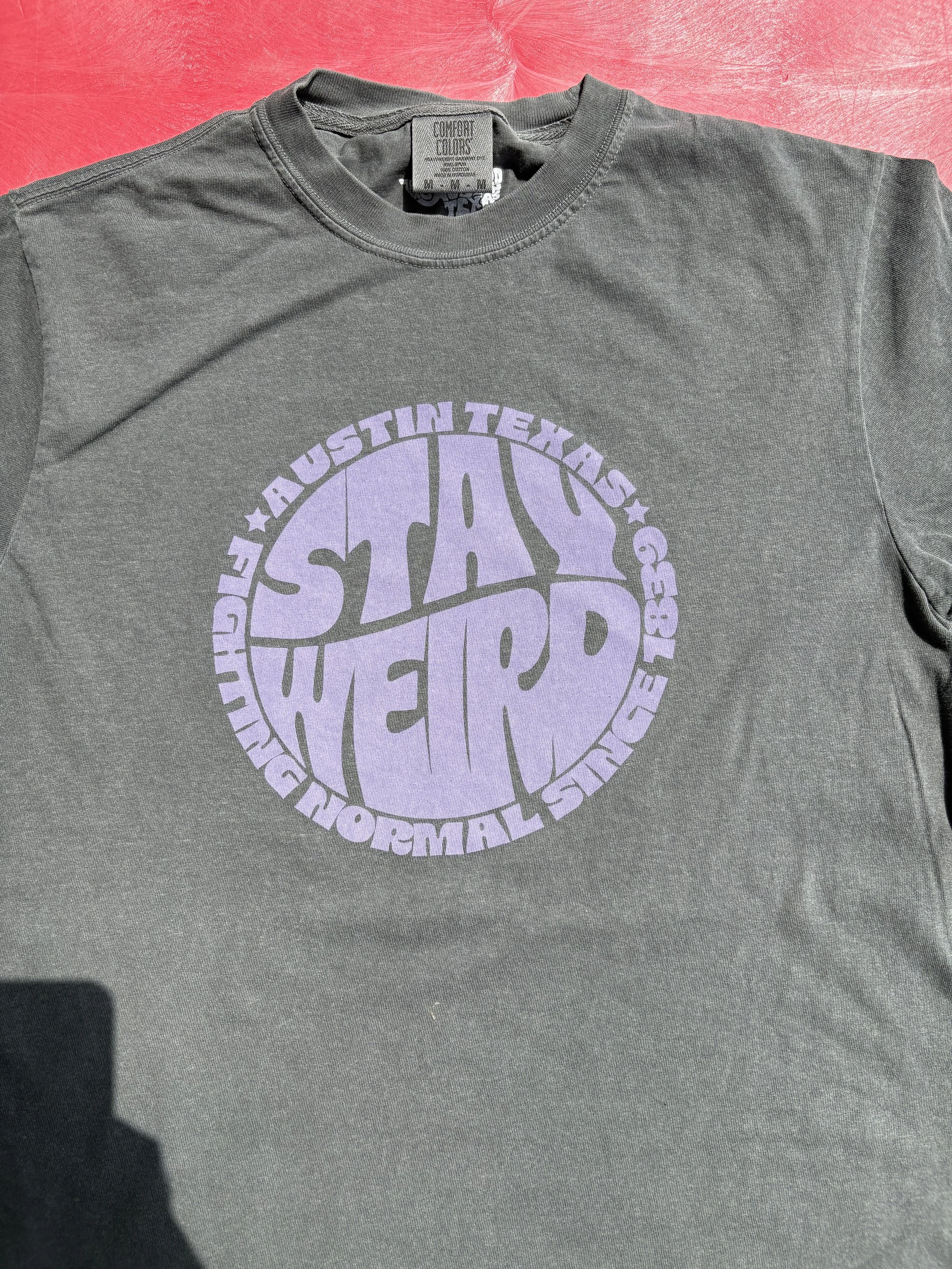 Custom discharge screen printing on retail apparel tees featuring an Austin Texas Keep It Weird graphic.