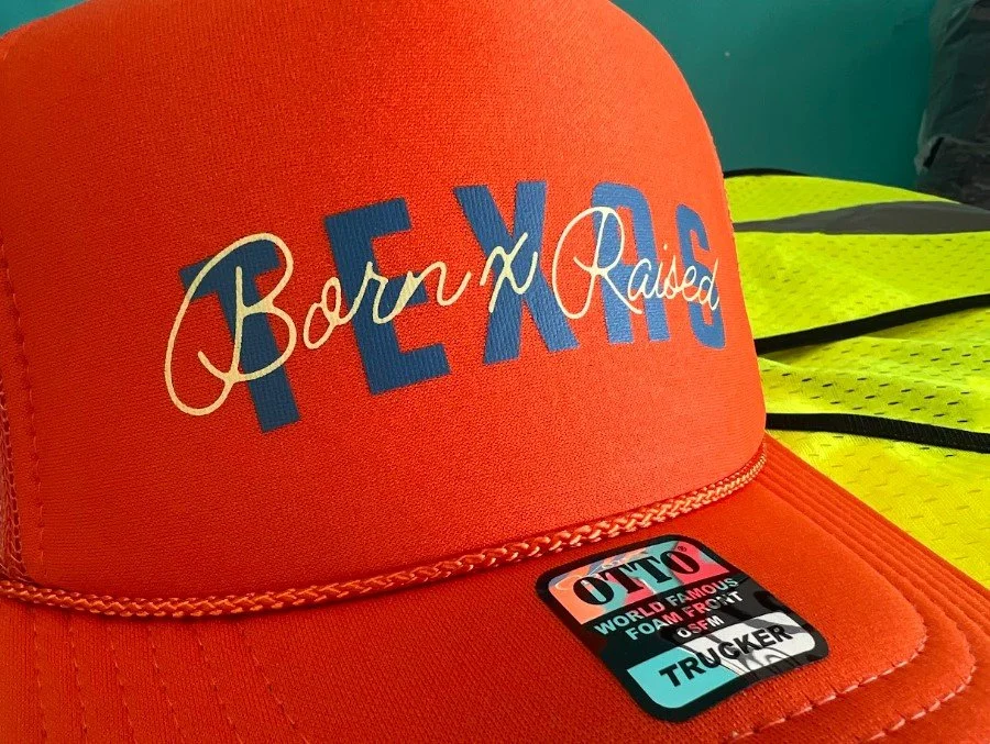 Custom embroidered corporate event swag hats produced for Born x Raised